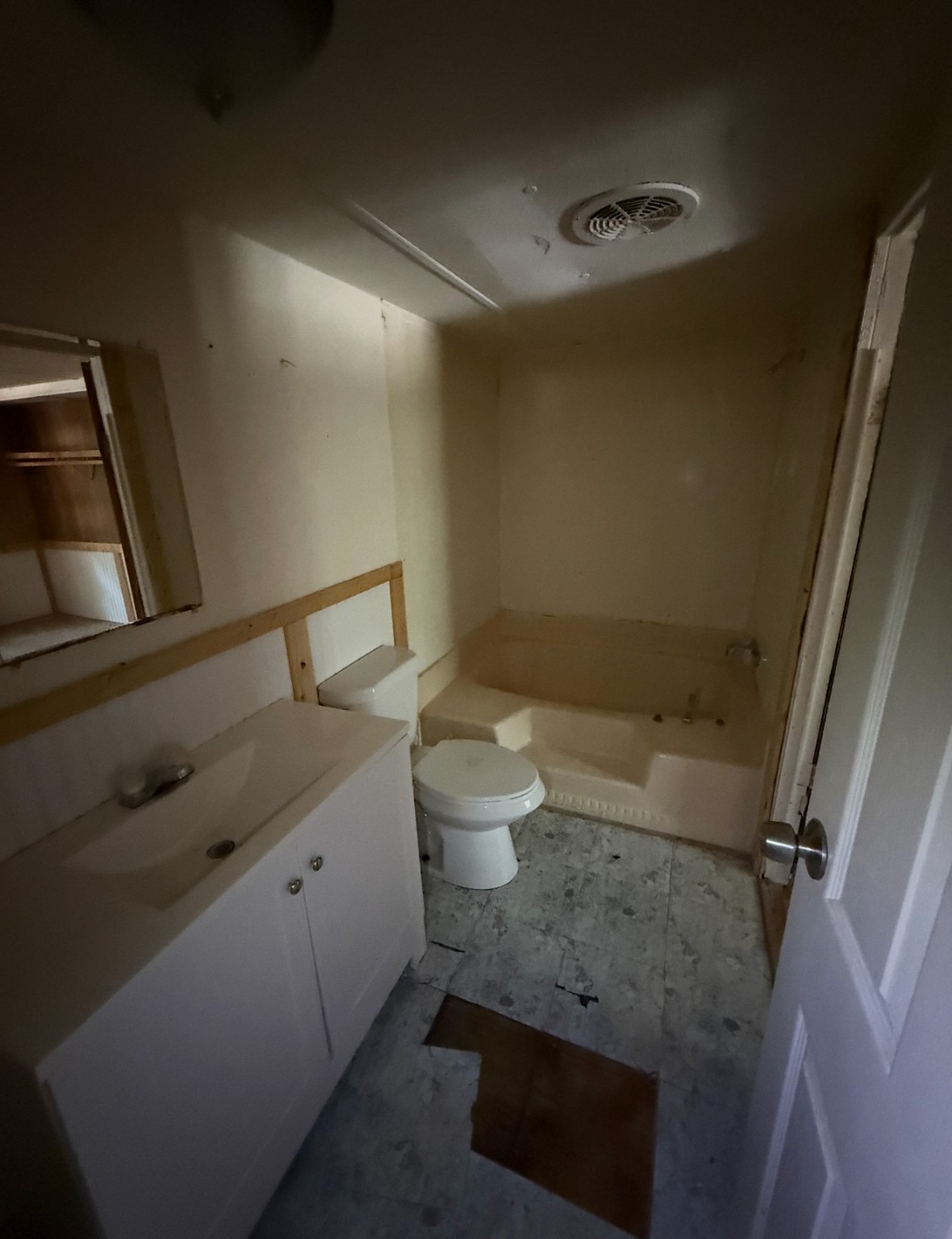 1059 Cardinal Lane Trinity, TX 75862 - Photo 7 of 7 a bathroom with a granite countertop sink toilet and a mirror