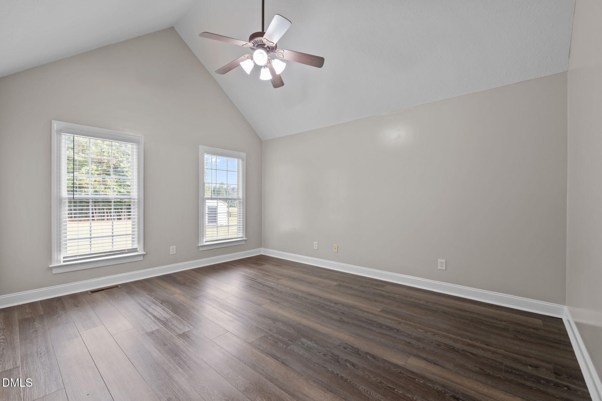 427 Fletcher Ridge Road Timberlake, NC 27583 - Photo 19 of 42 a view of empty room with wooden floor and fan