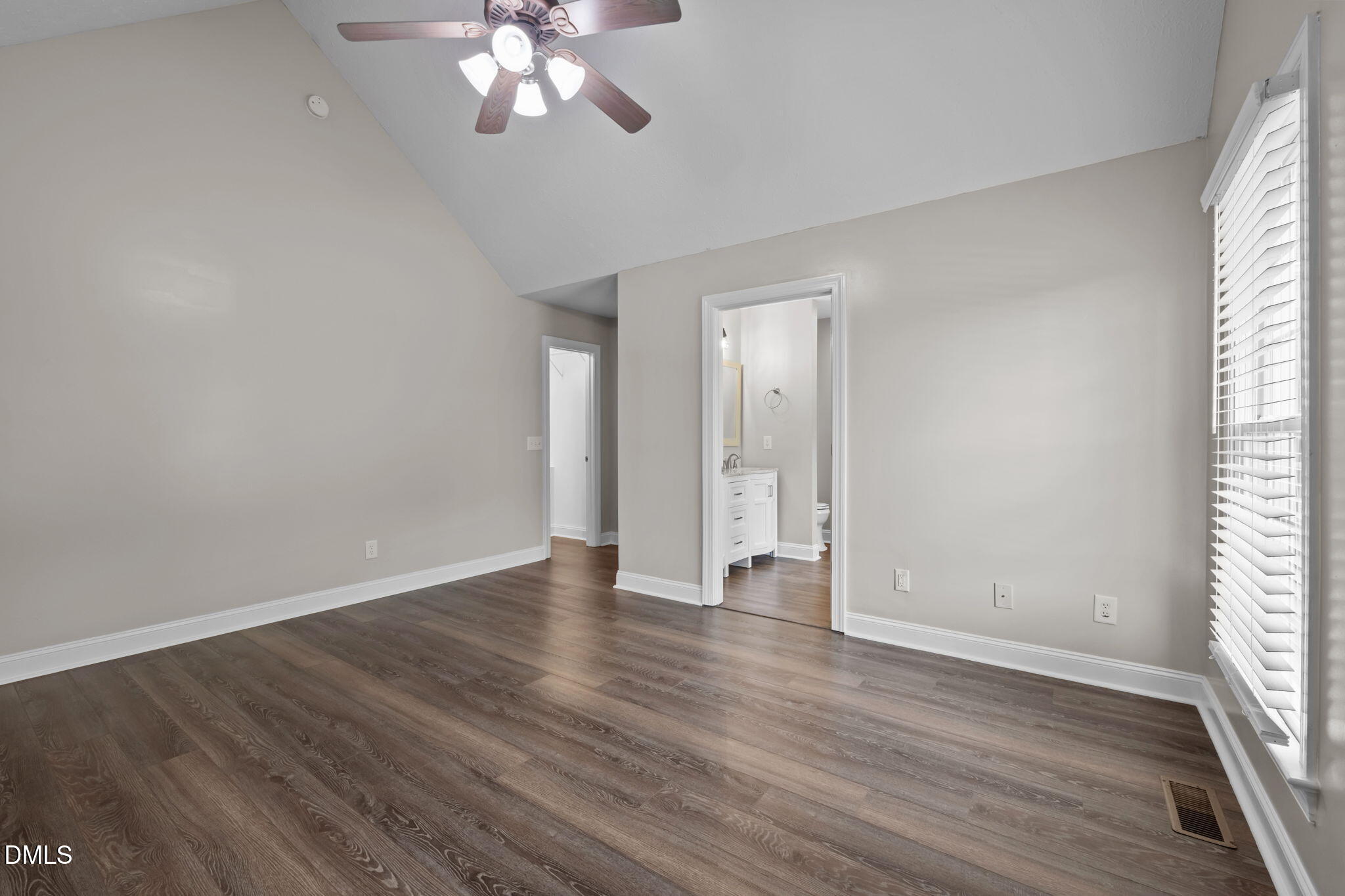 427 Fletcher Ridge Road Timberlake, NC 27583 - Photo 21 of 42 a view of an empty room with wooden floor and a window