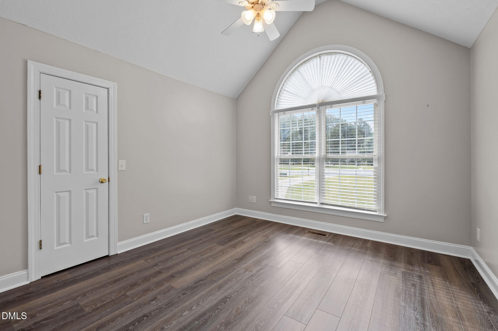 427 Fletcher Ridge Road Timberlake, NC 27583 - Photo 25 of 42 an empty room with wooden floor and windows