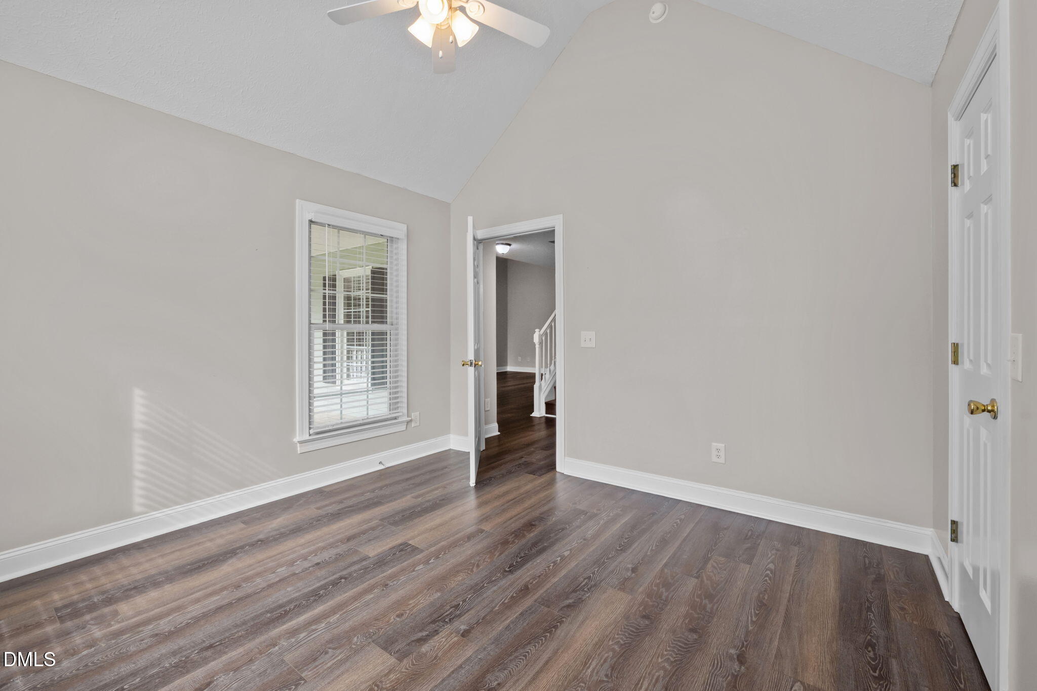 427 Fletcher Ridge Road Timberlake, NC 27583 - Photo 26 of 42 an empty room with wooden floor and windows