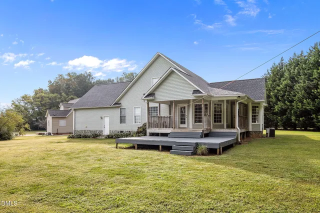 a front view of a house with a yard table and chairs