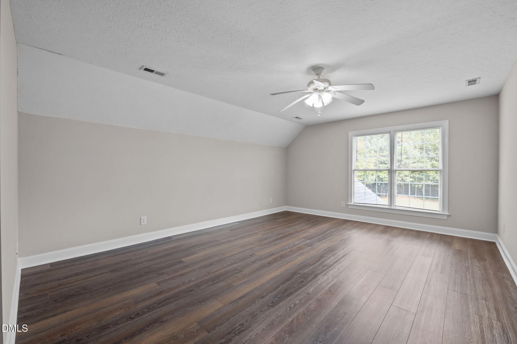 427 Fletcher Ridge Road Timberlake, NC 27583 - Photo 31 of 42 a view of a room with wooden floor and a ceiling fan