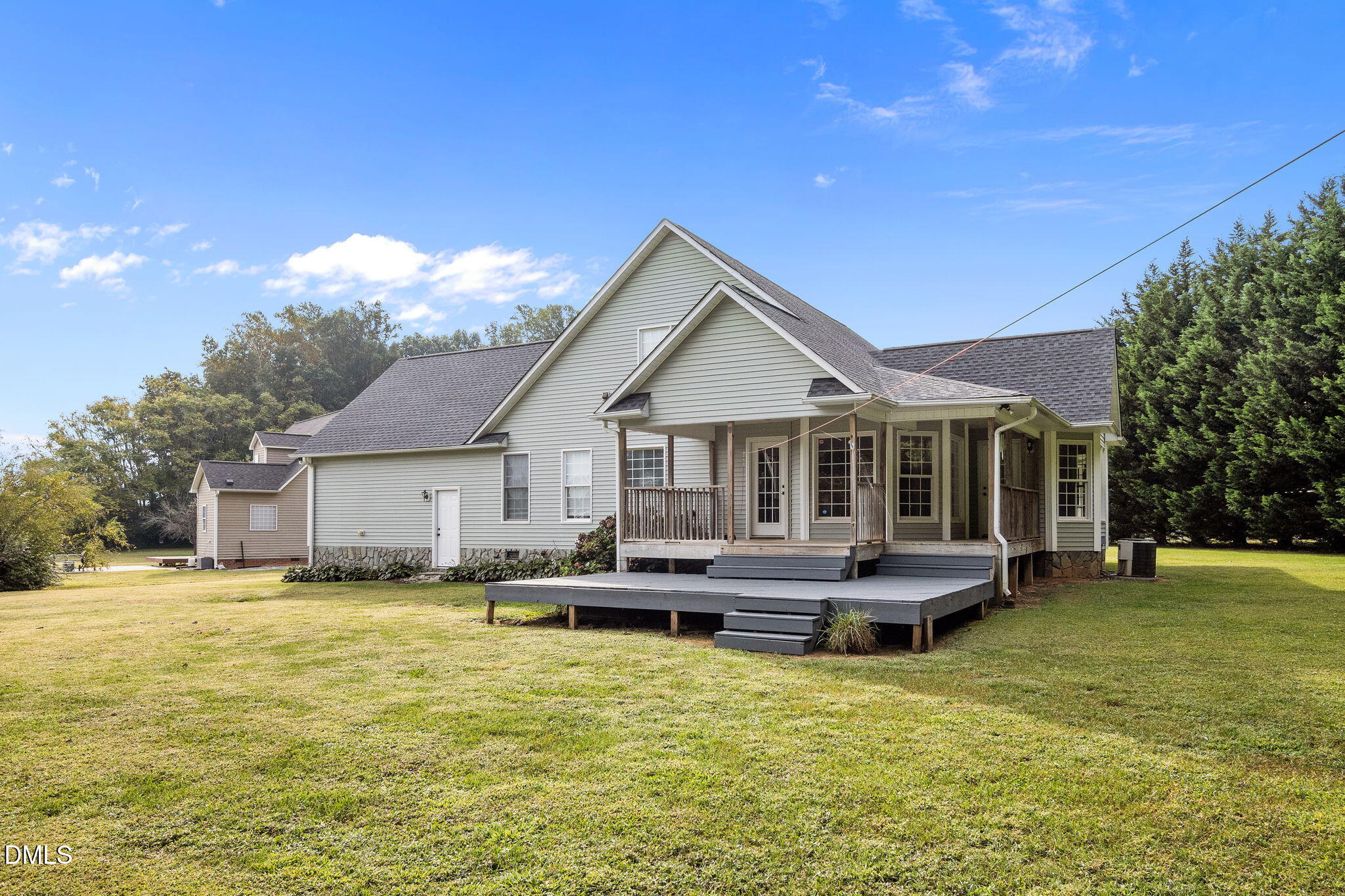 427 Fletcher Ridge Road Timberlake, NC 27583 - Photo 33 of 42 a front view of a house with a yard table and chairs