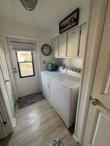 a utility room with a window dryer and washer