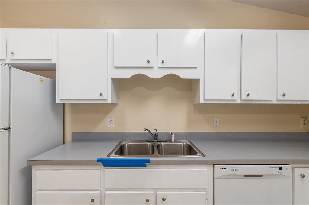 4329 Northwest 155th Street Reddick, FL 32686 - Photo 26 of 52 a kitchen with white cabinets and a sink