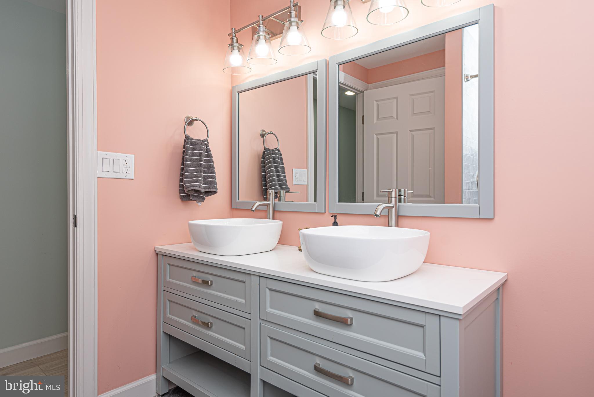 138 Old Wharf Road Ocean City, MD 21842 - Photo 15 of 33 a bathroom with a sink and a mirror