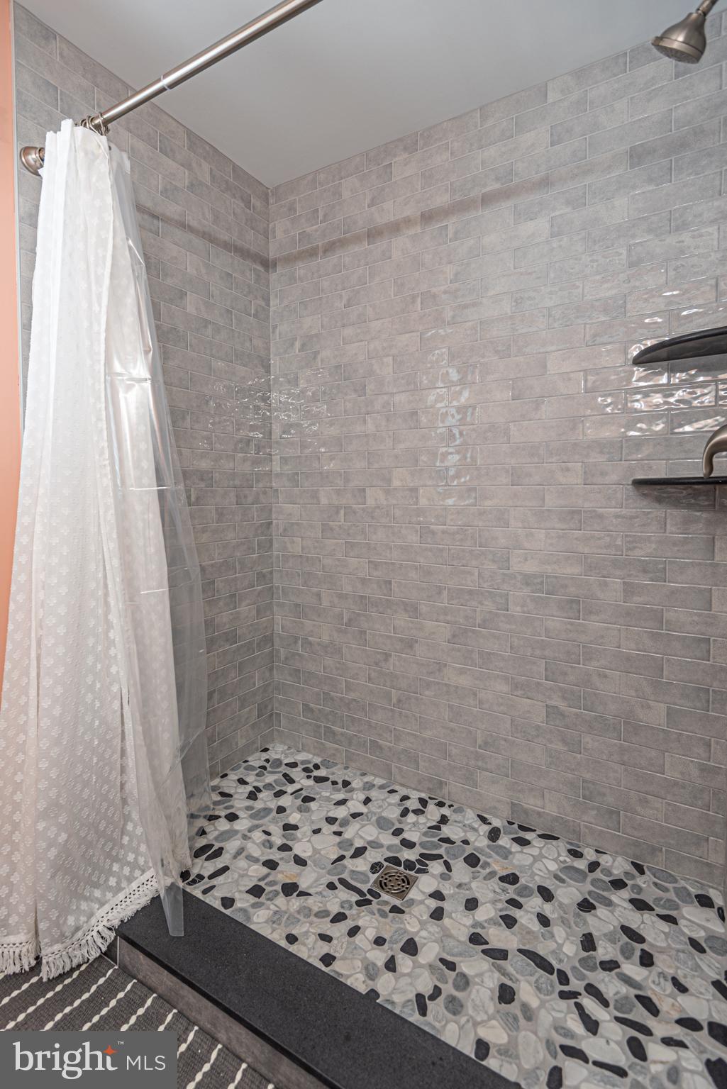 138 Old Wharf Road Ocean City, MD 21842 - Photo 17 of 33 a bathroom with a shower