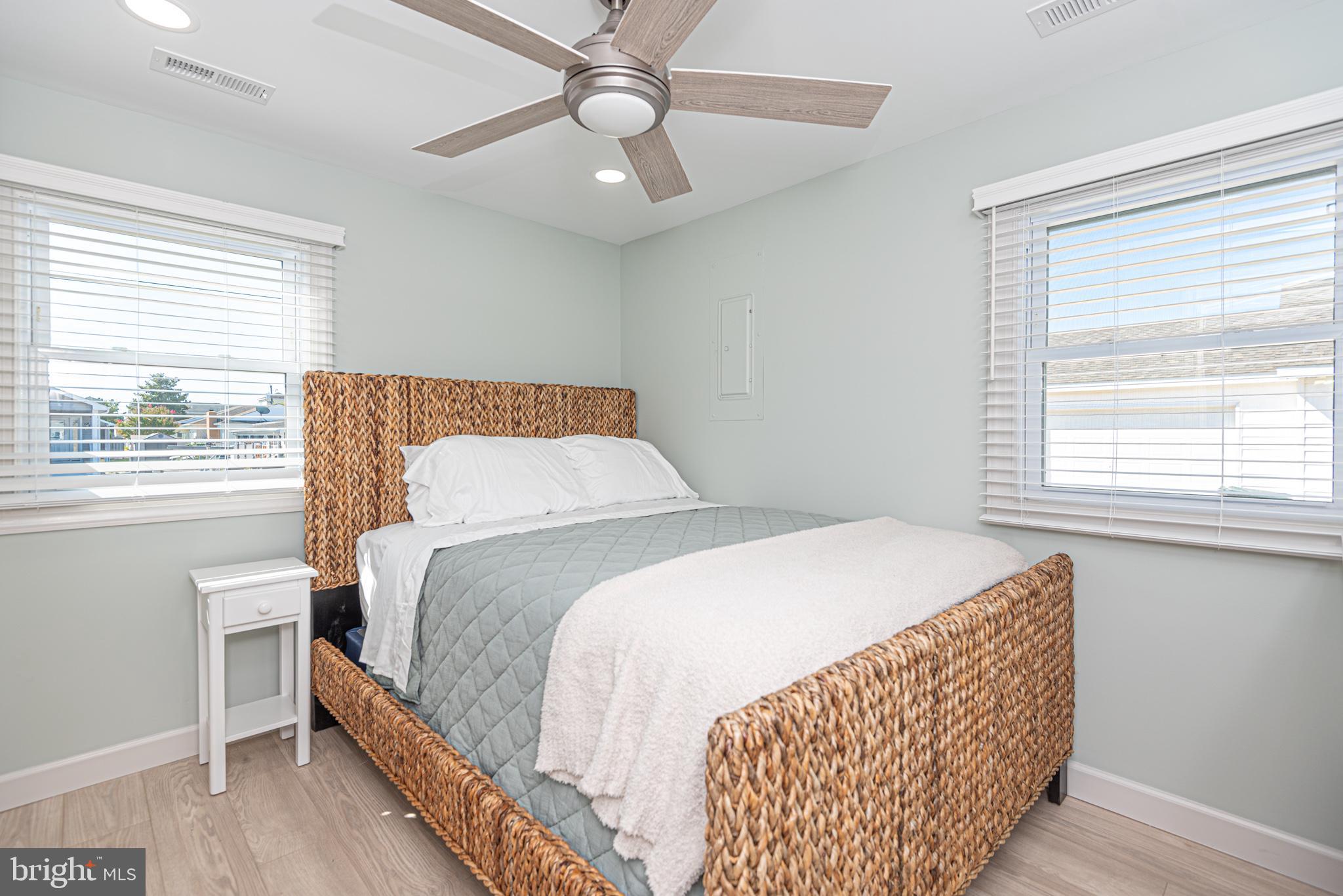 138 Old Wharf Road Ocean City, MD 21842 - Photo 18 of 33 a bedroom with a bed and a window