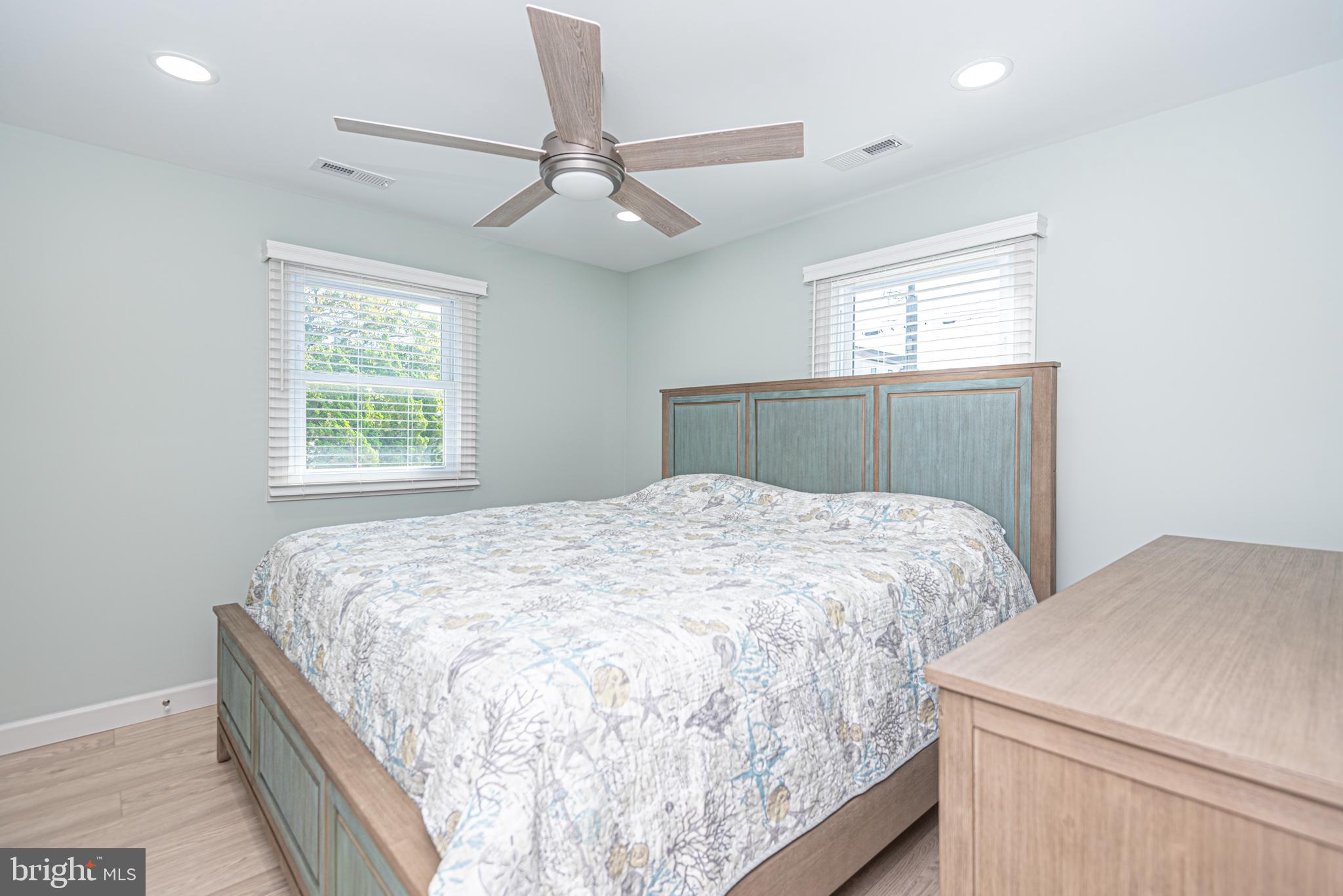 138 Old Wharf Road Ocean City, MD 21842 - Photo 19 of 33 a bedroom with a bed and window
