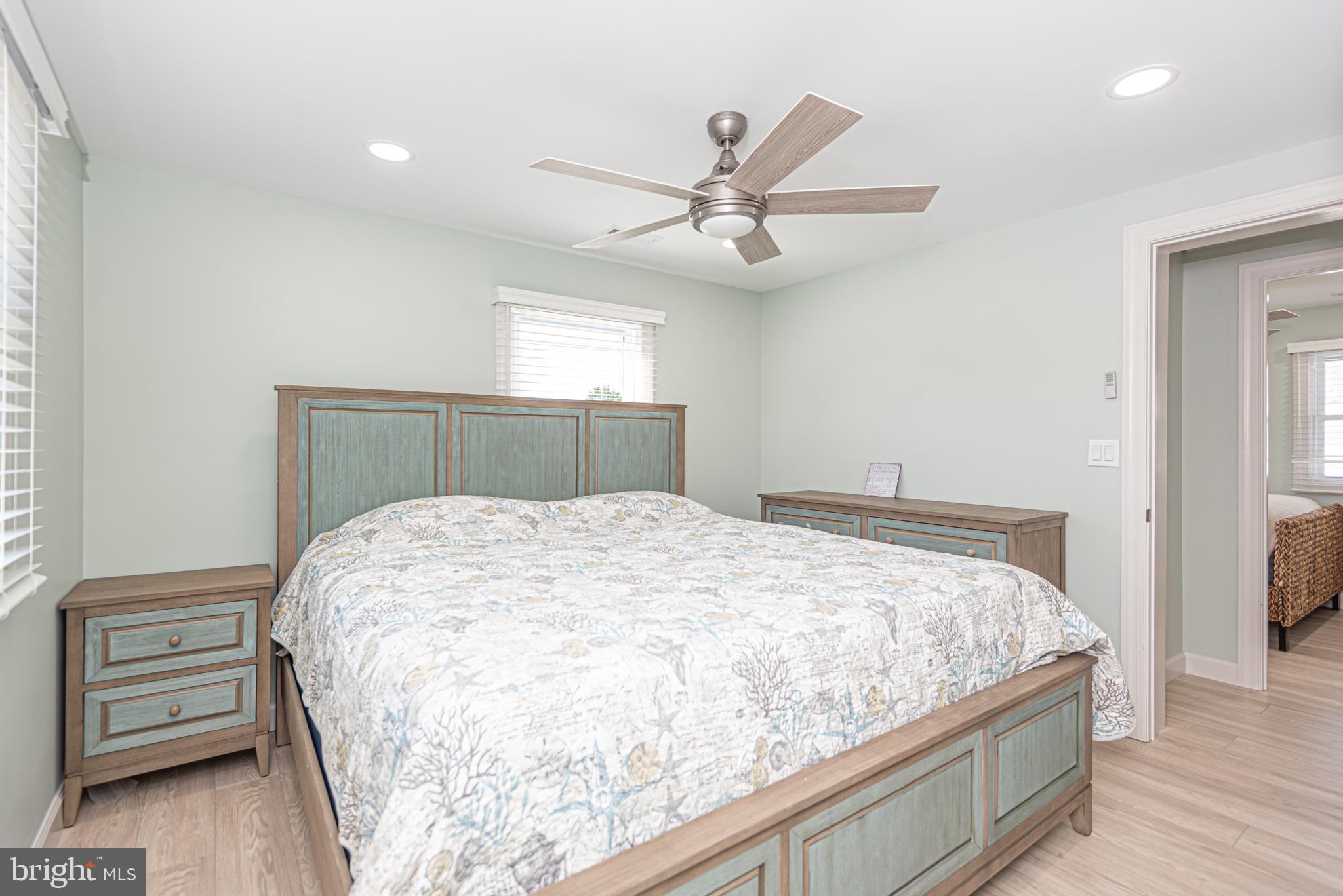 138 Old Wharf Road Ocean City, MD 21842 - Photo 20 of 33 a bedroom with a bed and a window
