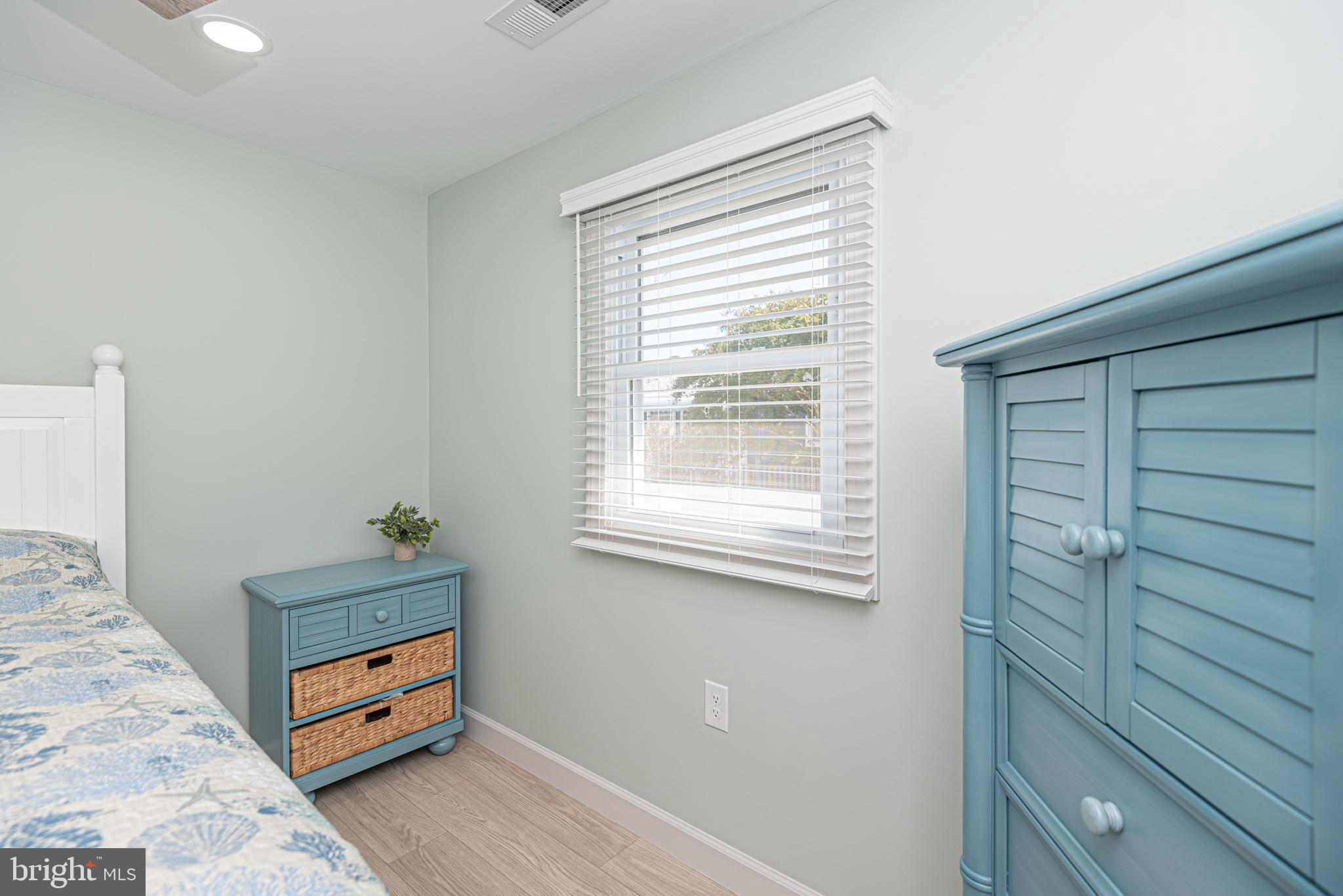 138 Old Wharf Road Ocean City, MD 21842 - Photo 25 of 33 a room with furniture and a window