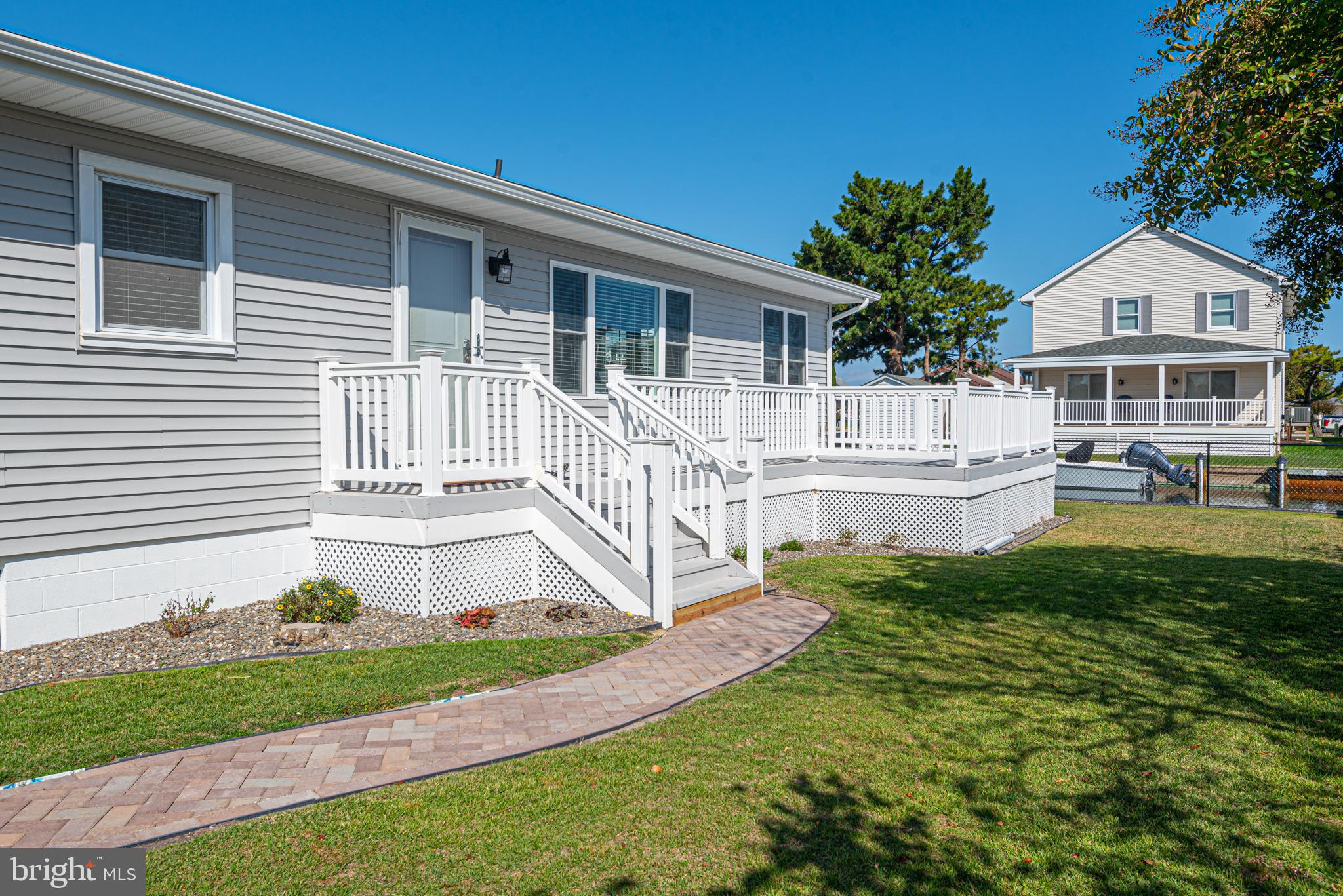 138 Old Wharf Road Ocean City, MD 21842 - Photo 4 of 33 a house with garden in front of it
