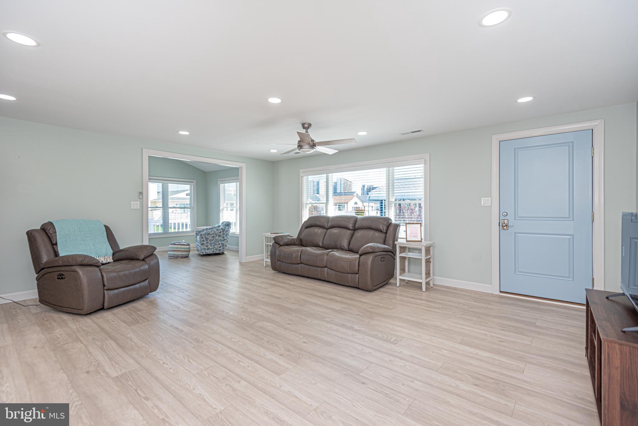 138 Old Wharf Road Ocean City, MD 21842 - Photo 9 of 33 a living room with furniture and a wooden floor