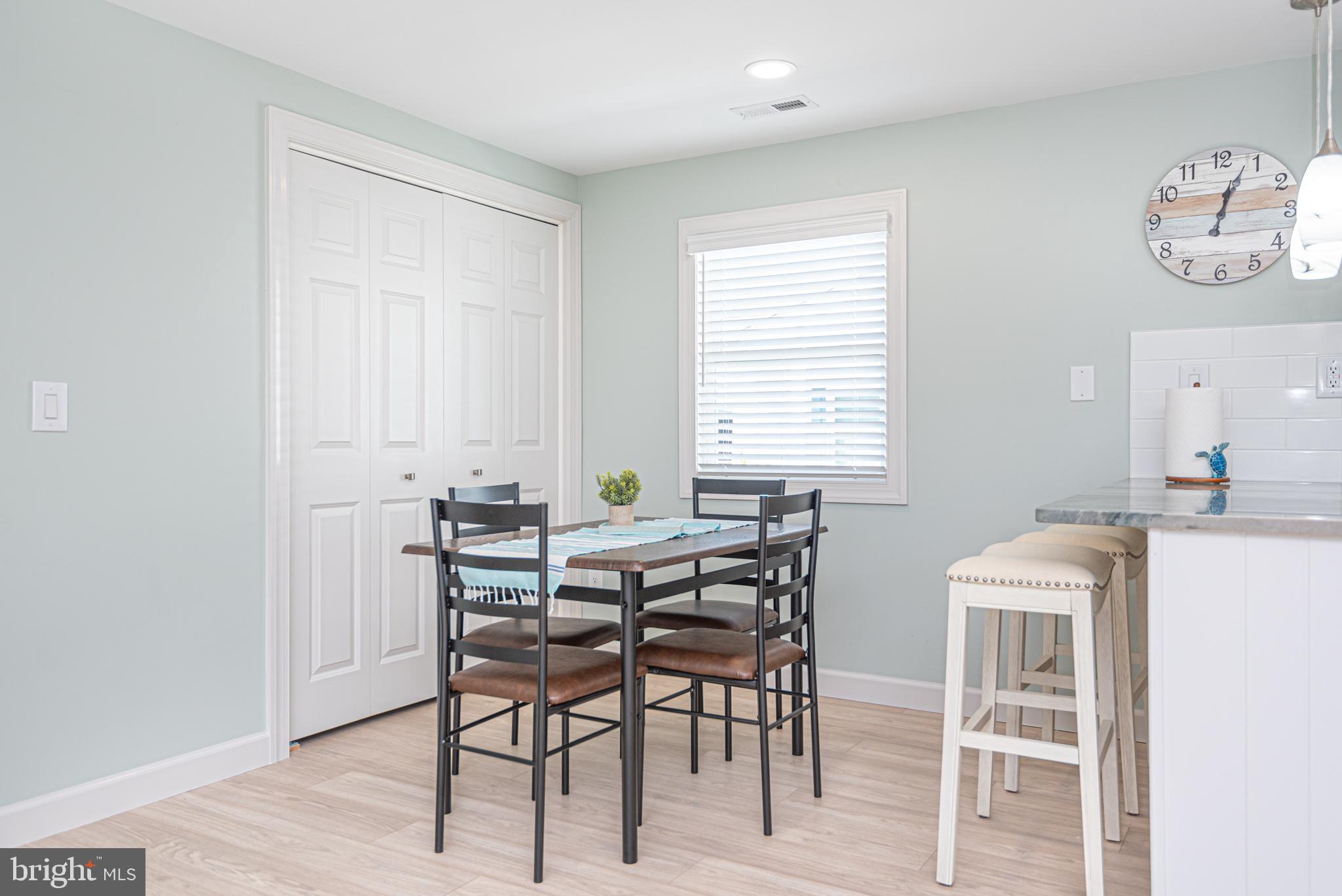 138 Old Wharf Road Ocean City, MD 21842 - Photo 10 of 33 a view of a dining room with furniture and a window