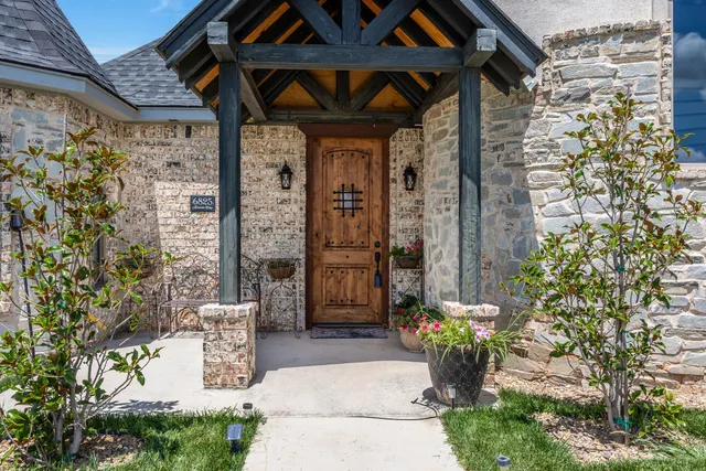 a front view of a house with outdoor seating