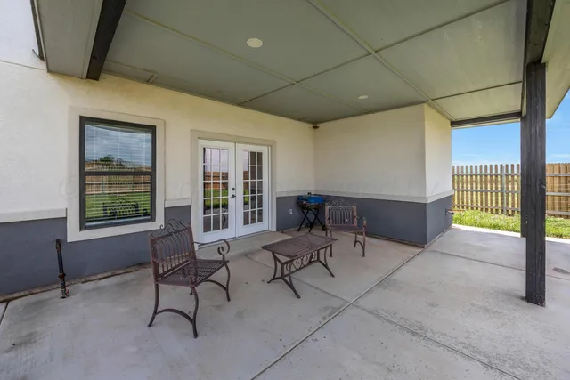 a view of a livingroom with furniture and a window
