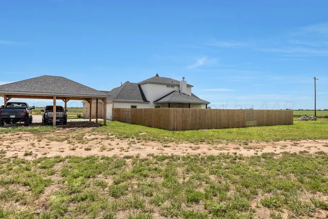 a backyard of a house with lots of green space