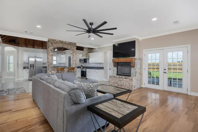 a living room with furniture and a flat screen tv