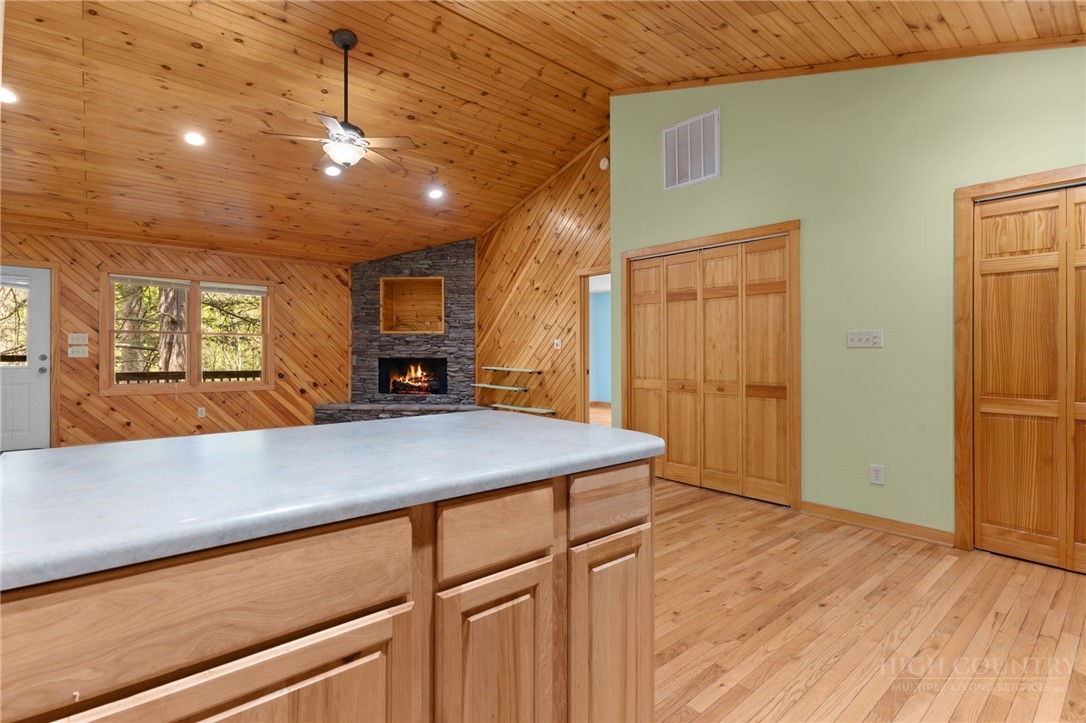 148 Woodby Ridge Road Vilas, NC 28692 - Photo 7 of 33 a kitchen with kitchen island a counter top space a sink stainless steel appliances and cabinets