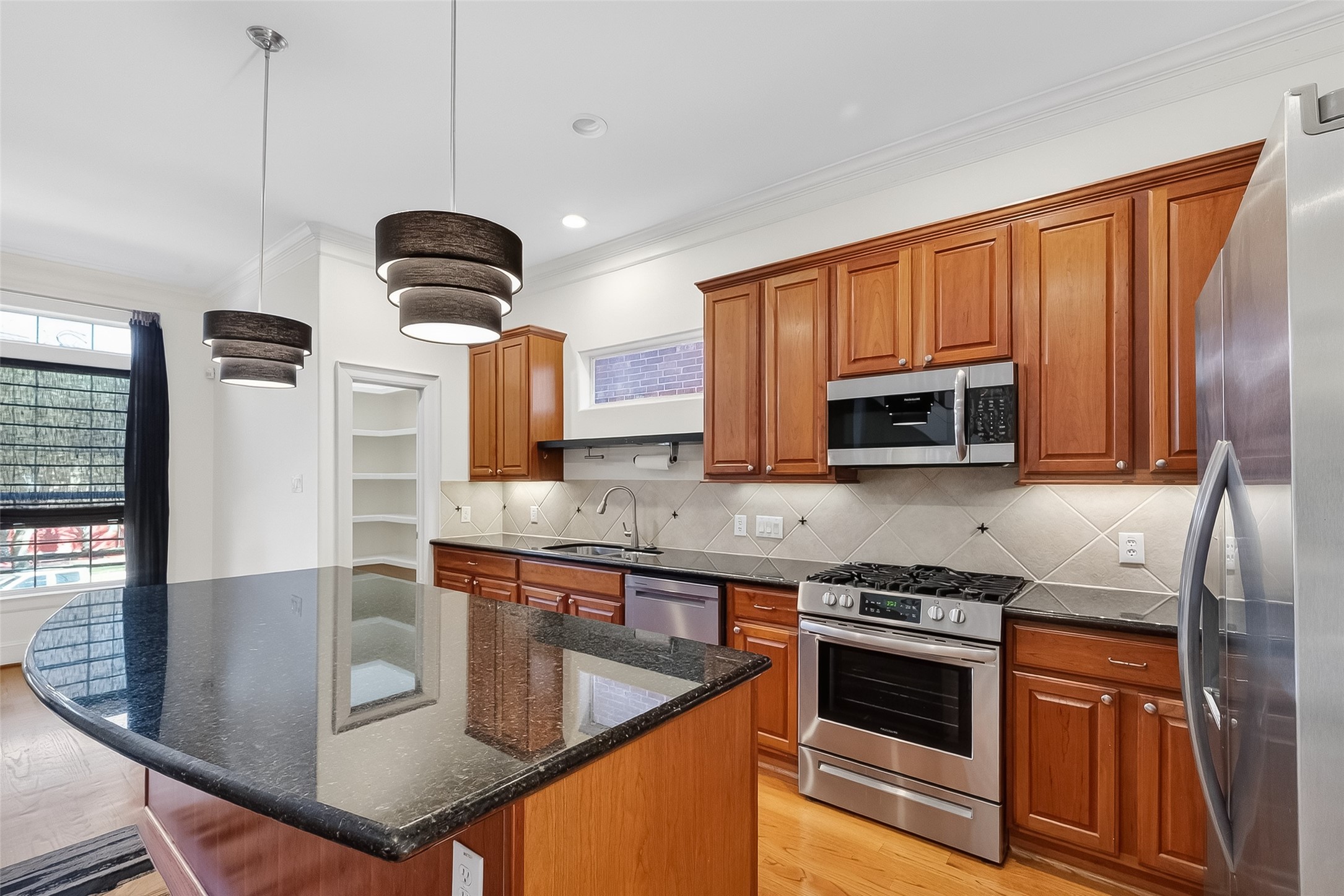 1004 Stanford Street, Unit A Houston, TX 77019 - Photo 15 of 38 Stainless steel package includes Frigidaire refrigerator/freezer, gas stove, SS microwave and dishwasher