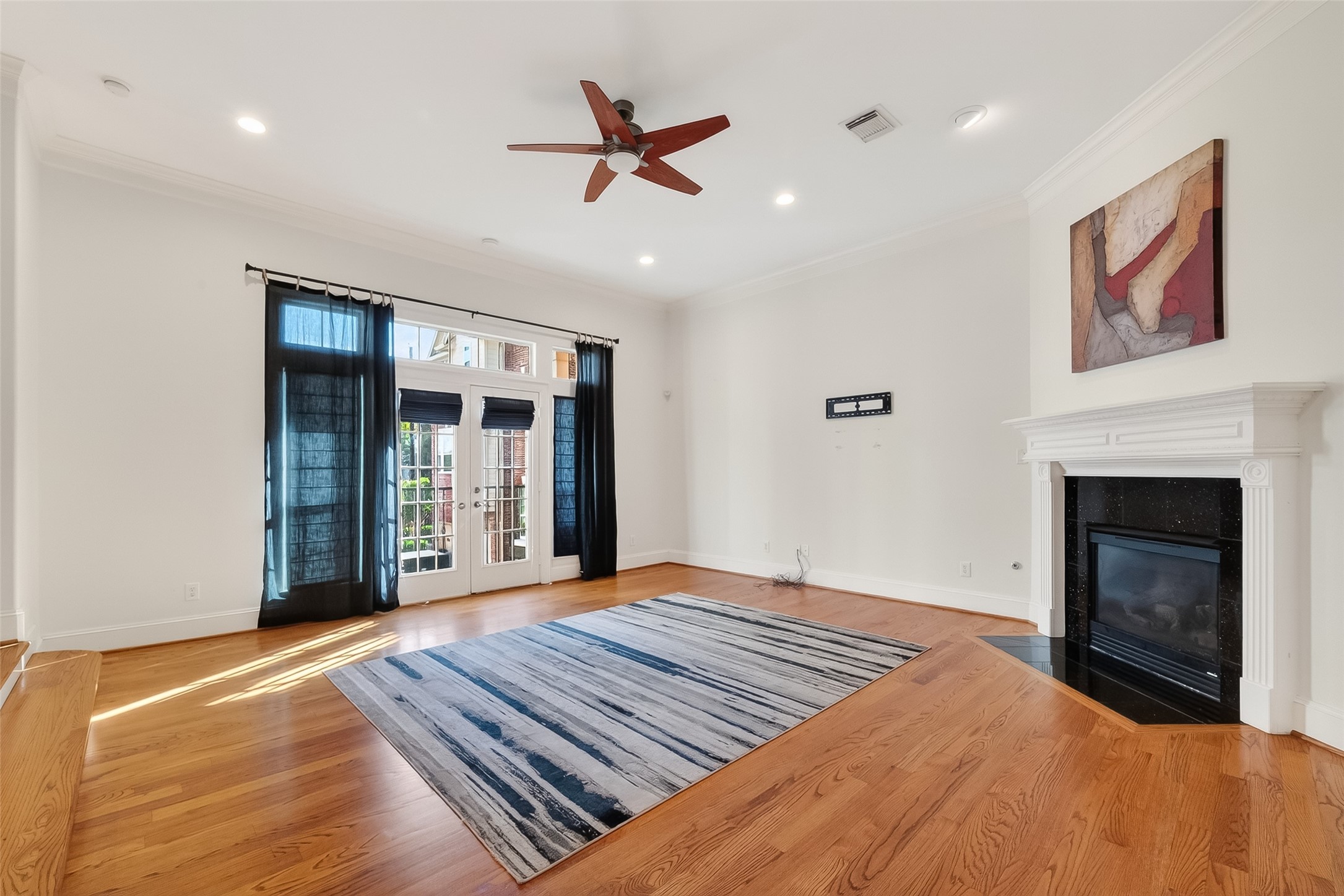 1004 Stanford Street, Unit A Houston, TX 77019 - Photo 22 of 38 double doors in living allow for exit to private balcony on 2nd floor. Generous space for family gatherings and entertaining or to enjoy treasured moments together.