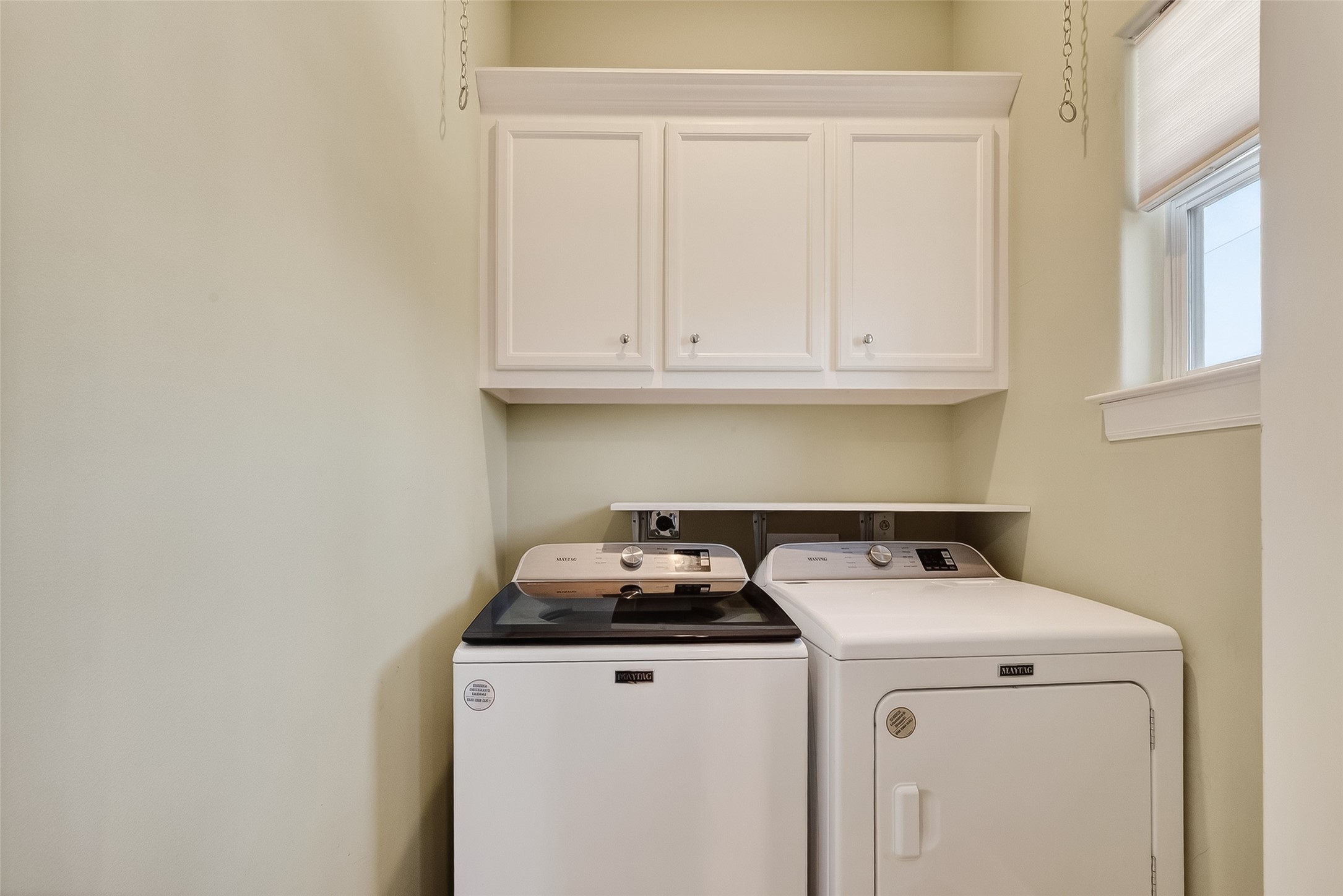 1004 Stanford Street, Unit A Houston, TX 77019 - Photo 26 of 38 Washer & dryer with cabinet/storage for utility needs.