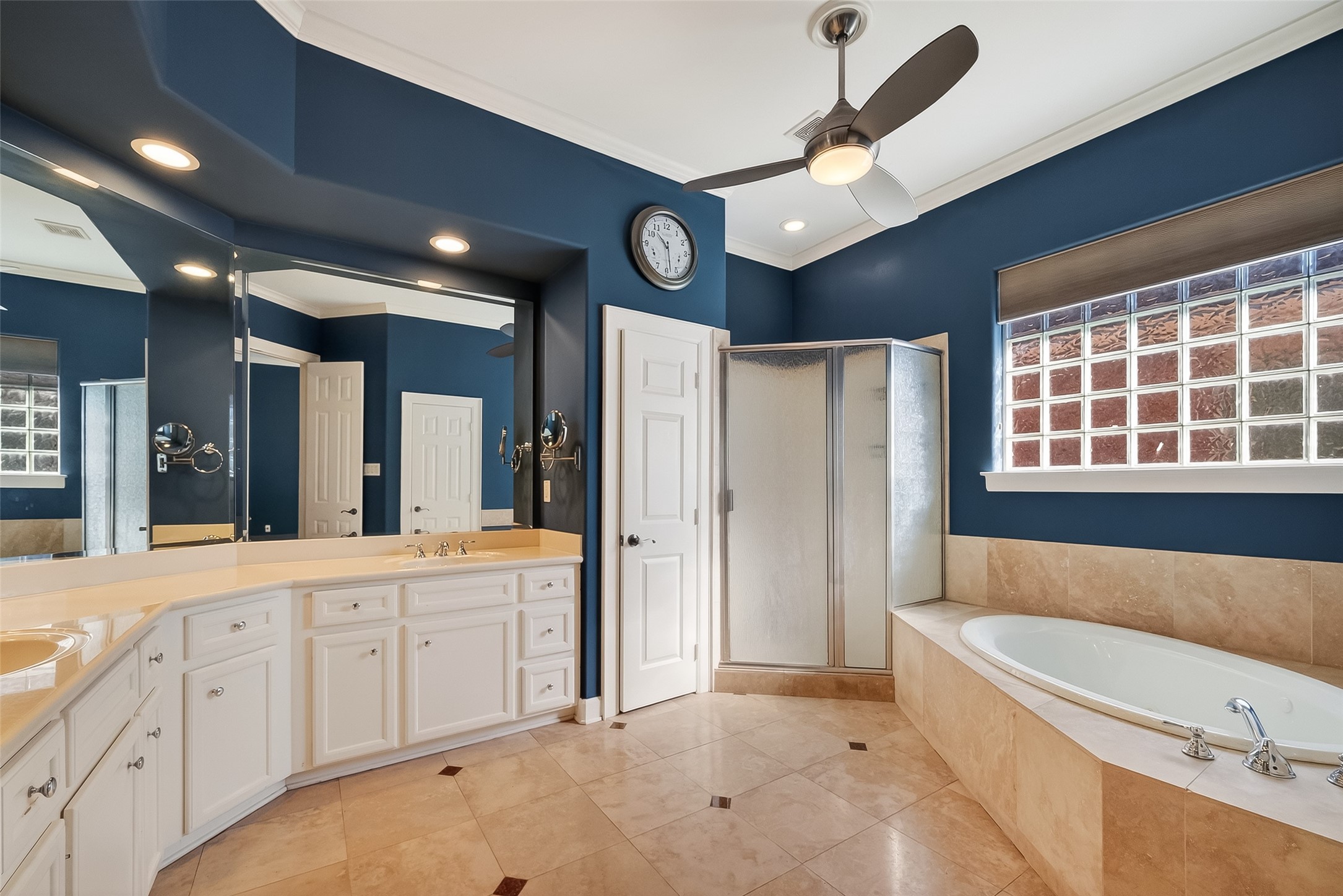 1004 Stanford Street, Unit A Houston, TX 77019 - Photo 30 of 38 primary en suite bath is loaded with all the luxury features. double sinks, separate jetted tub, stand up shower, travertine floors, linen closet and custom paint color