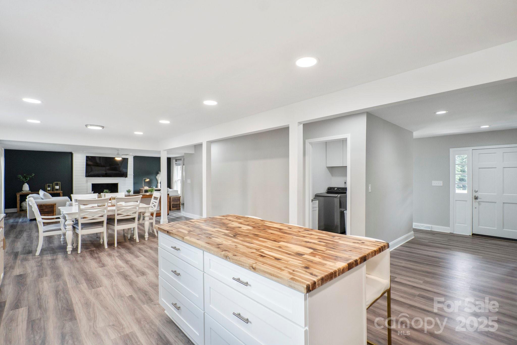 554 Isle Of Pines Road Mooresville, NC 28117 - Photo 15 of 44 a large kitchen with kitchen island a island in it