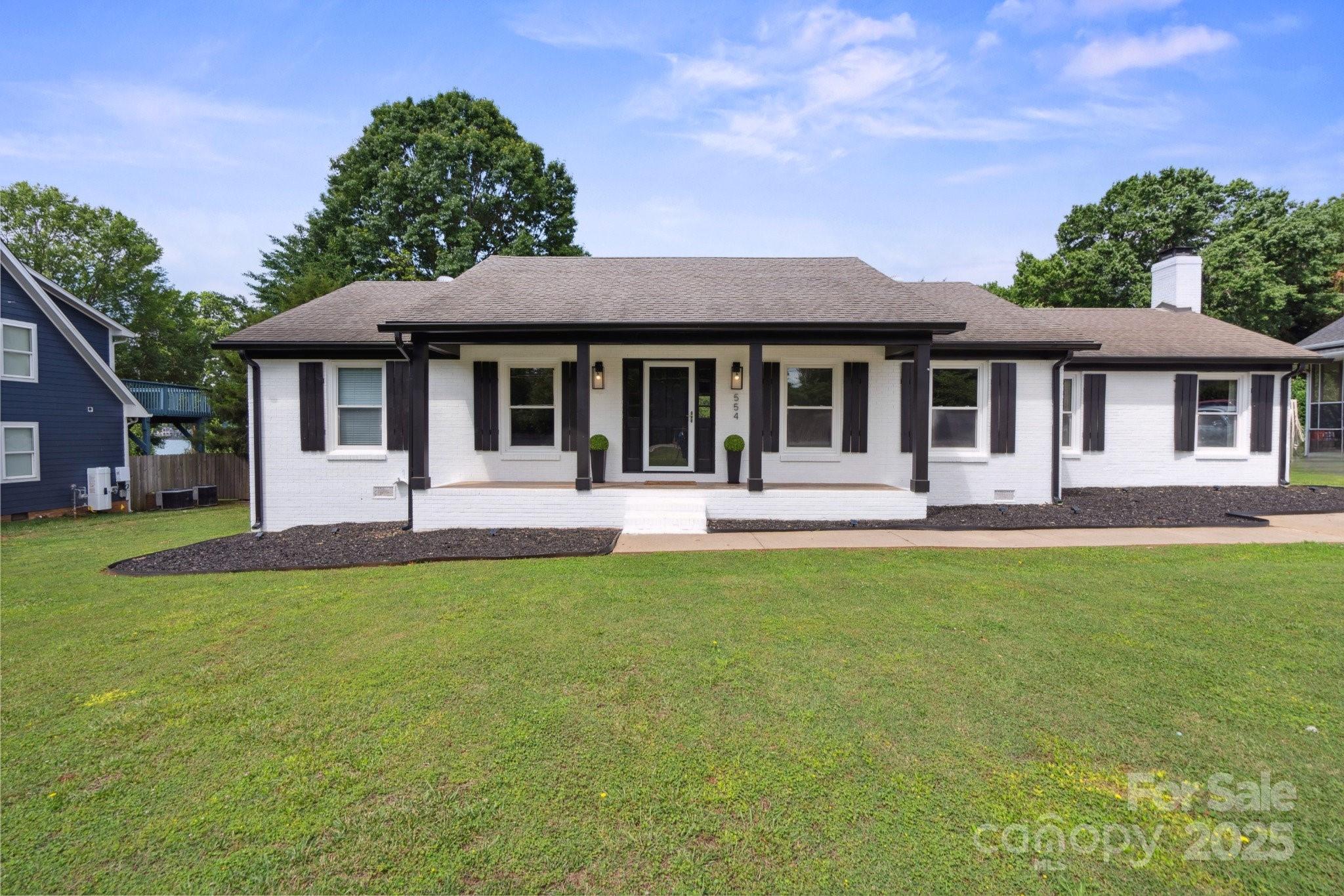 554 Isle Of Pines Road Mooresville, NC 28117 - Photo 2 of 44 front view of a house with a yard