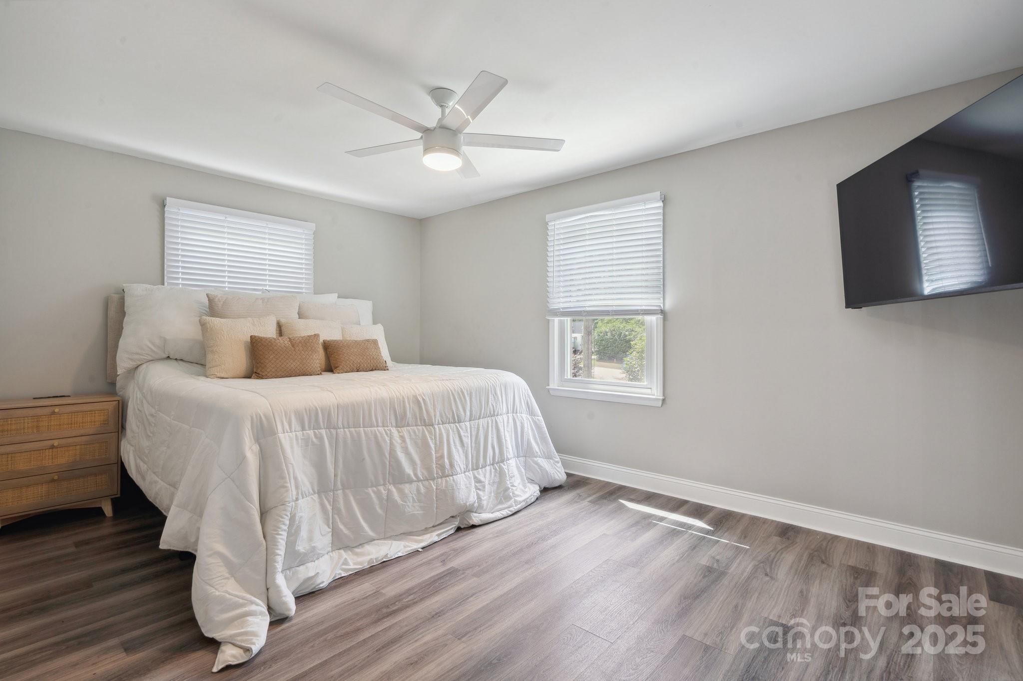 554 Isle Of Pines Road Mooresville, NC 28117 - Photo 22 of 44 a bedroom with a large bed and a window