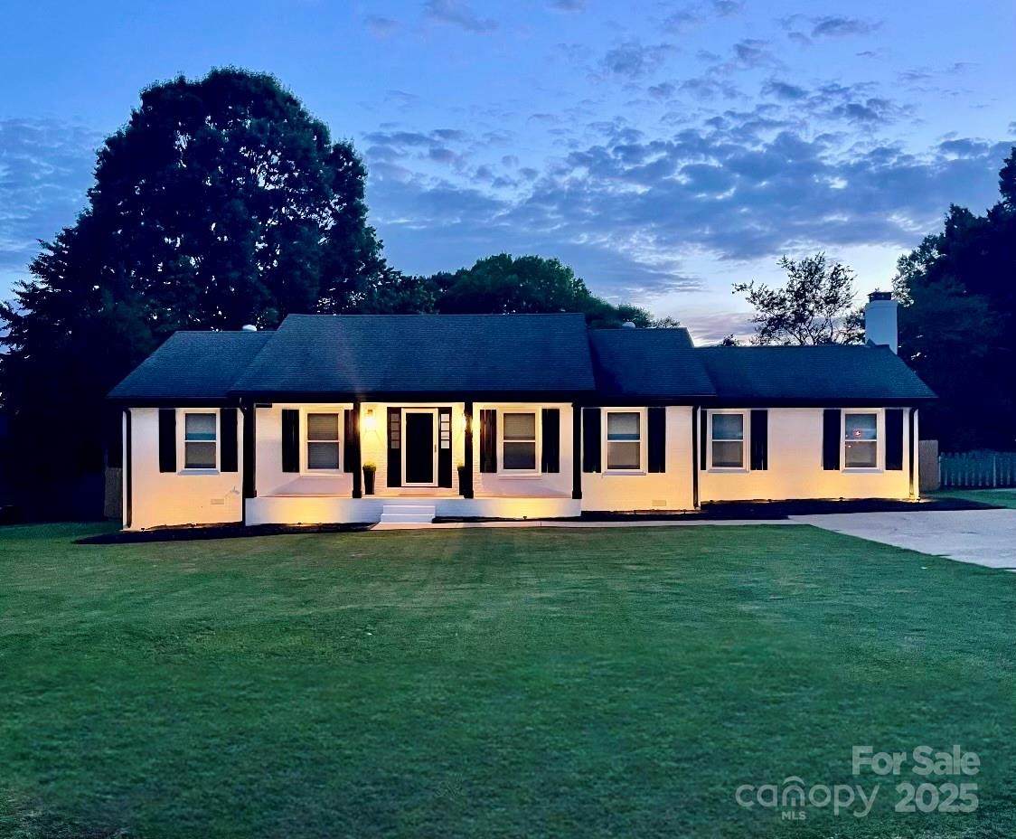 554 Isle Of Pines Road Mooresville, NC 28117 - Photo 3 of 44 a view of a house with a swimming pool and a yard