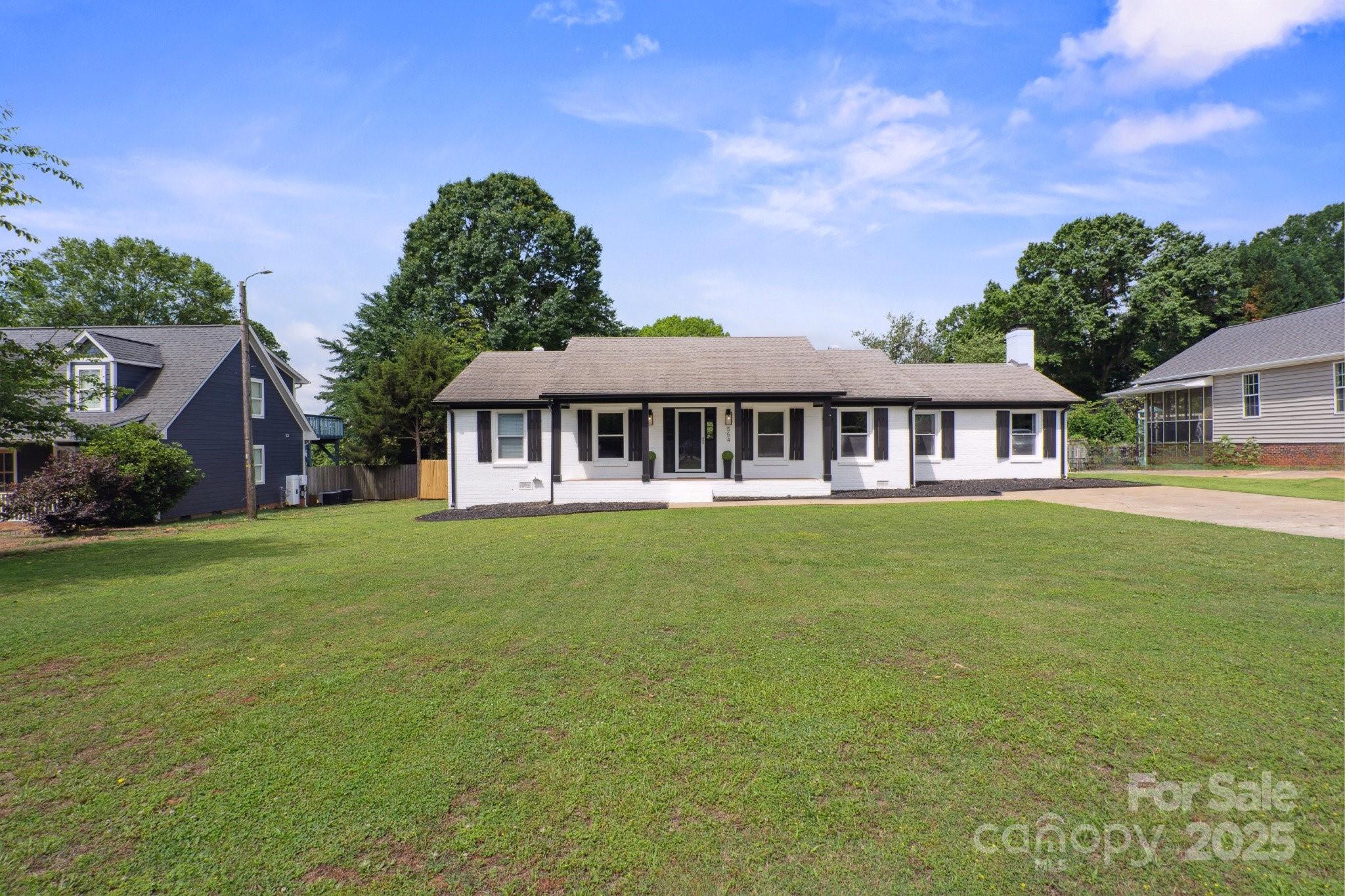 554 Isle Of Pines Road Mooresville, NC 28117 - Photo 5 of 44 a view of a house with a yard