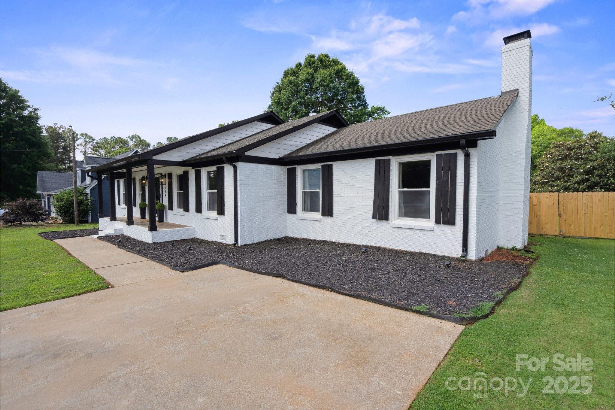 554 Isle Of Pines Road Mooresville, NC 28117 - Photo 6 of 44 a front view of a house with a yard