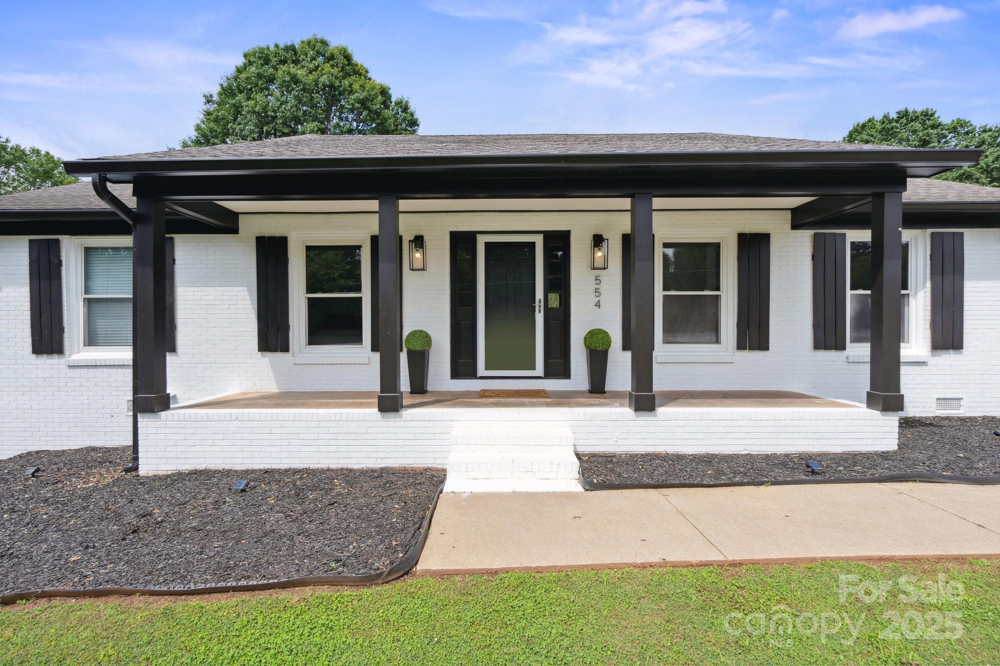 554 Isle Of Pines Road Mooresville, NC 28117 - Photo 7 of 44 front view of a house with a porch