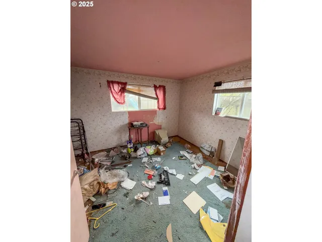 a reading room with furniture and a window