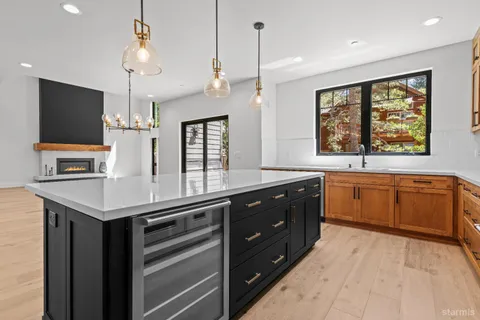 a kitchen with a refrigerator and a sink
