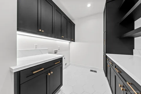 a kitchen with a sink and cabinets