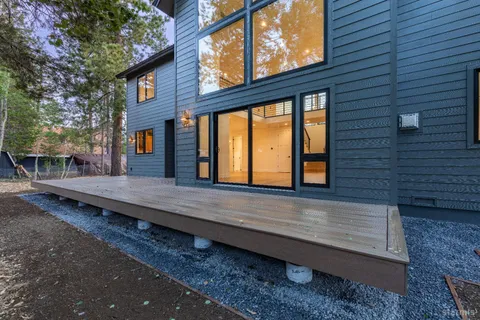 a wooden bench sitting in front of a building