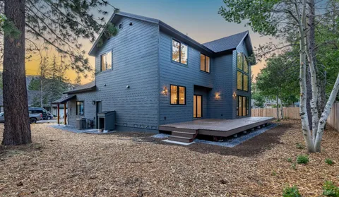 a backyard of a house with barbeque oven
