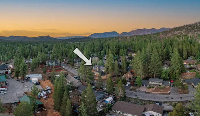 a view of a lush green hillside and a houses