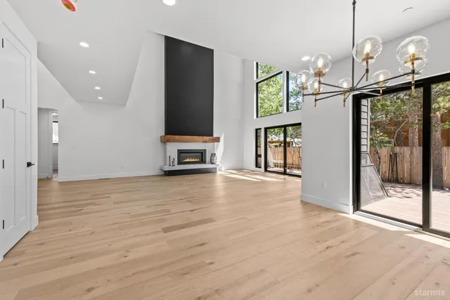 a view of a livingroom with furniture window and wooden floor