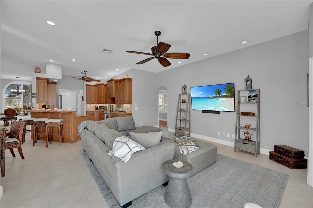 2436 Deborah Drive Punta Gorda, FL 33950 - Photo 15 of 66 a living room with furniture kitchen view and a chandelier