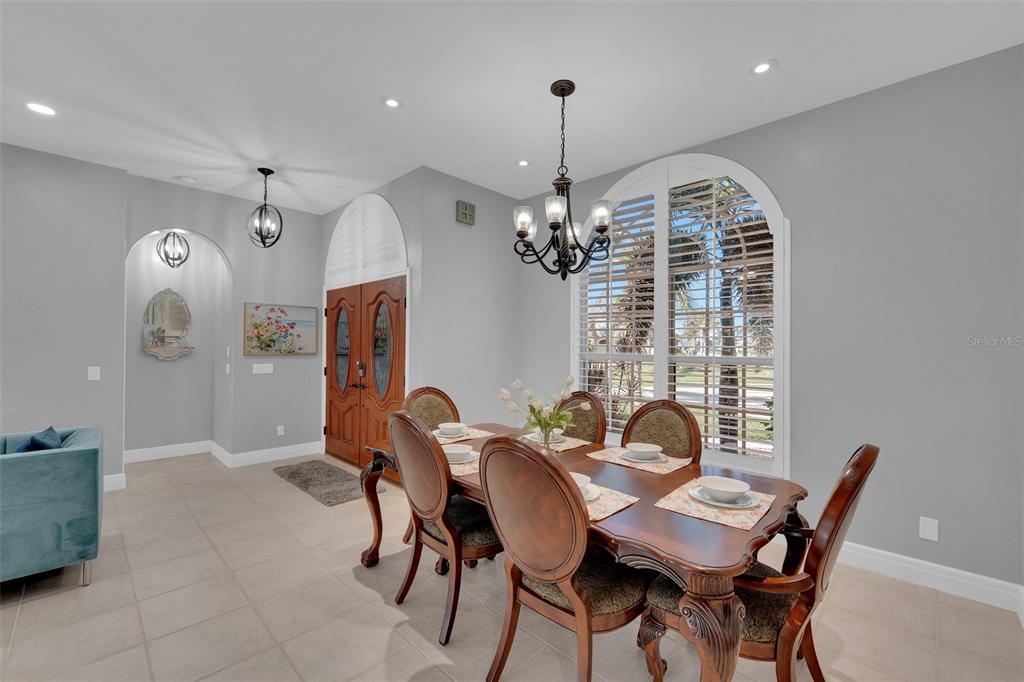 2436 Deborah Drive Punta Gorda, FL 33950 - Photo 17 of 66 a view of a dining room with furniture and chandelier