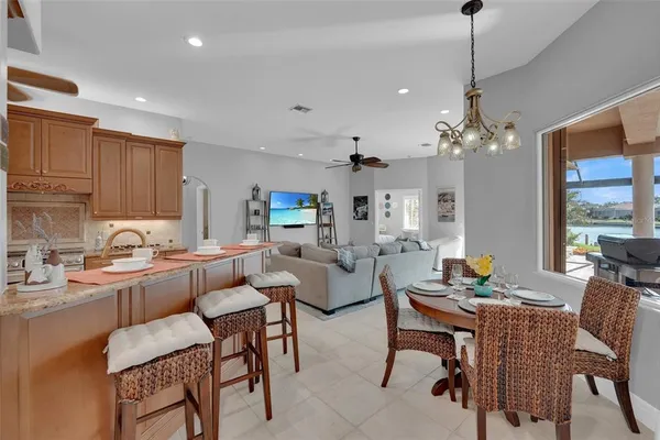 a bedroom with a large bed and a ceiling fan