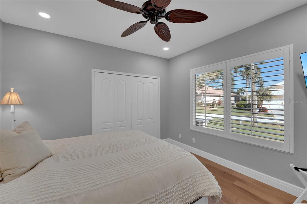 2436 Deborah Drive Punta Gorda, FL 33950 - Photo 21 of 66 a bedroom with a large bed and a window