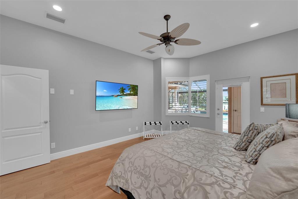 2436 Deborah Drive Punta Gorda, FL 33950 - Photo 27 of 66 a bedroom with a large bed and a window
