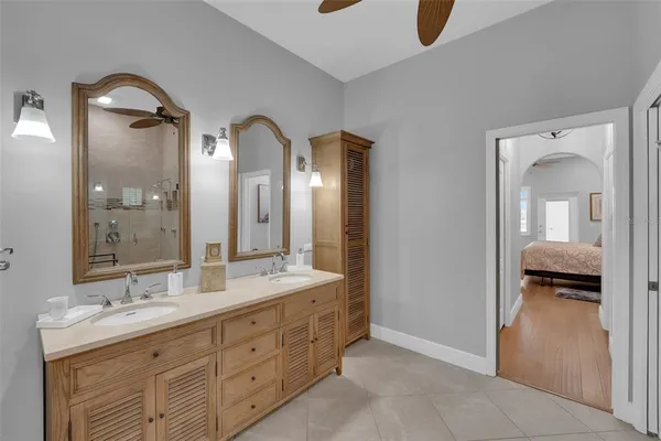 a view of a house with a yard and potted plants