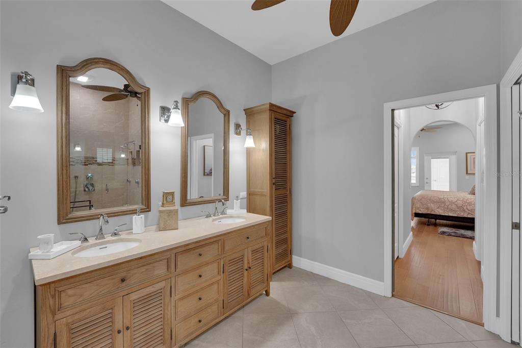 2436 Deborah Drive Punta Gorda, FL 33950 - Photo 30 of 66 a en suite bathroom with a double vanity sink and a mirror