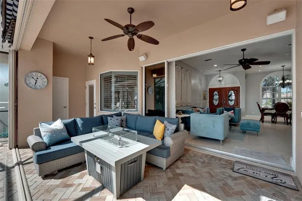 a view of a backyard with sitting area and furniture